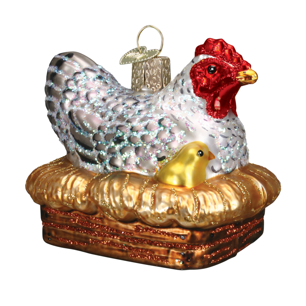 Håndlavet glaskuge, der er formet som en høne på rede med kyllinger